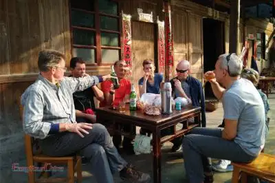 Uk travelers dine at a local home in Guilin
