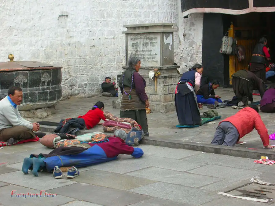 Local Tibetan people pray in front of Jokhang Temple in Lhasa