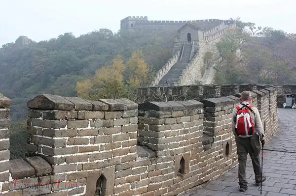A senior traveler hiking on Mutianyu Great Wall