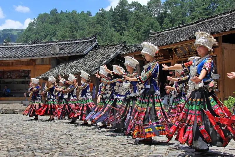 Miao girls dressed in traditional clothes in Xijiang Miao Village Guizhou